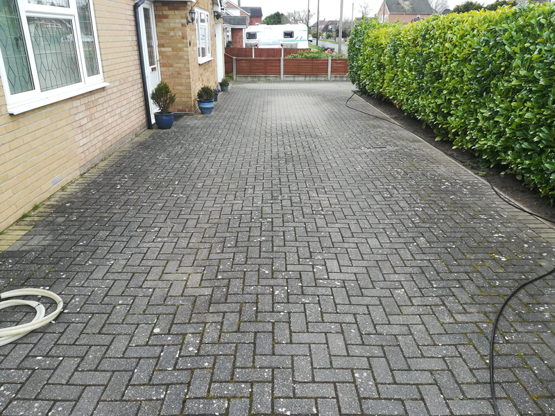 Before pic of driveway cleaned in Colchester by Fairhall Jet Wash